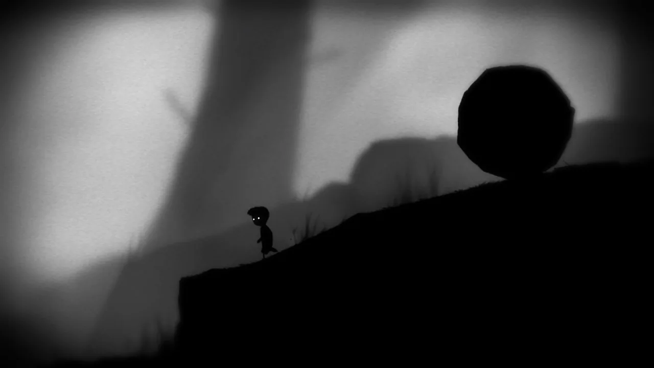 A large boulder on a slope above the boy (LIMBO, via Steam)